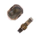 Two late 19th to early 20th century gold memorial rings. The first designed as a buckle ring, with
