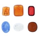 A selection of twenty-three loose fob seals. To include two hardstone reverse intaglio armorial