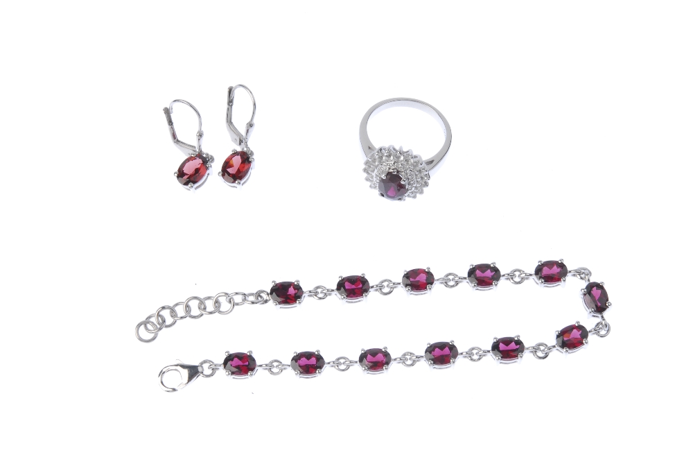 A selection of silver gem-set jewellery. To include a garnet line bracelet and matching ear - Image 2 of 3
