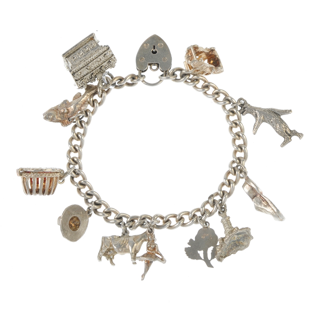 A selection of silver and white metal jewellery. To include a charm bracelet, the curb-link chain