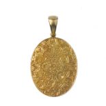 A late 19th century gold photograph pendant. The oval-shape floral and foliate engraved pendant,