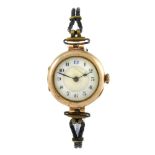A wrist watch. 9ct yellow gold case, import hallmark London 1923. Unsigned manual wind movement. Two