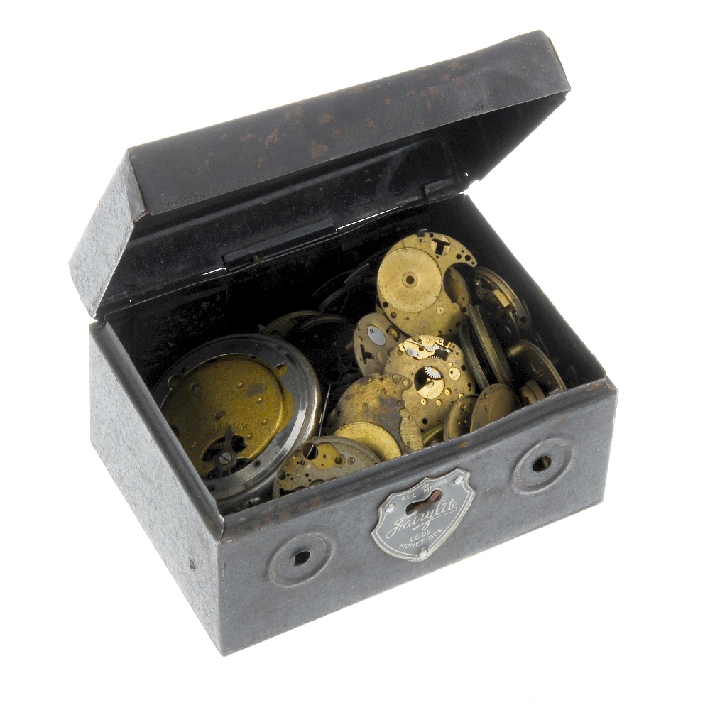 A mixed group of watch and clock parts, to include movements, watches, dials etc. All offered for