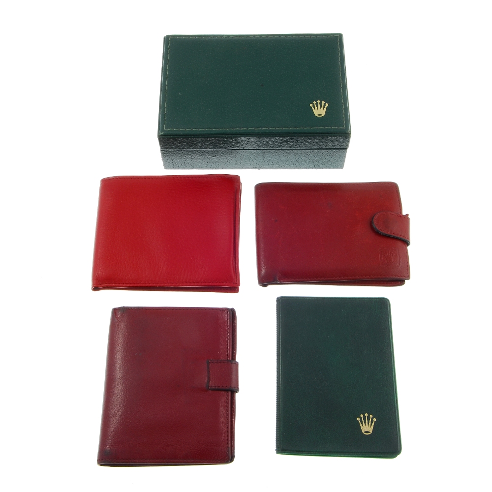 A selection of Rolex branded wallets, pads, document folder, inner box and a tray branded Baume &
