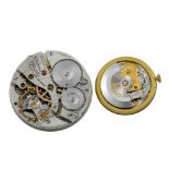 A pair of watch movements, consisting of a Garrard automatic watch movement and a Waltham pocket