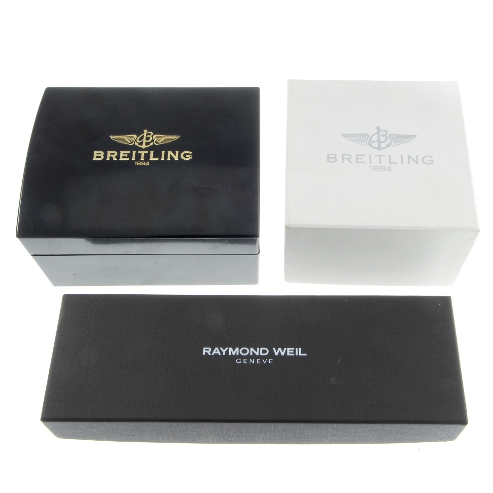 A trio of watch boxes, to include a Raymond Weil box and two Breitling boxes, some incomplete.