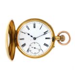 A half hunter pocket watch. Yellow metal case, stamped 18K with poincon. Unsigned keyless wind