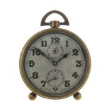 An alarm clock by Zenith Watch Co. Brass case, numbered 16638. Manual wind movement with alarm