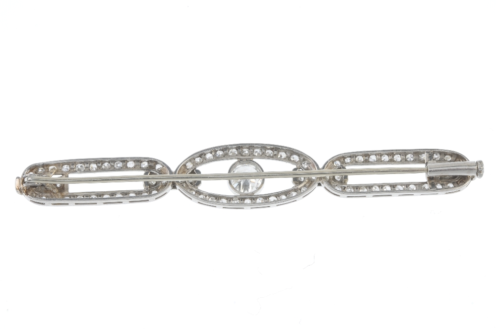 An early 20th century diamond bar brooch. The circular-cut diamond collet, within a single-cut - Image 2 of 2
