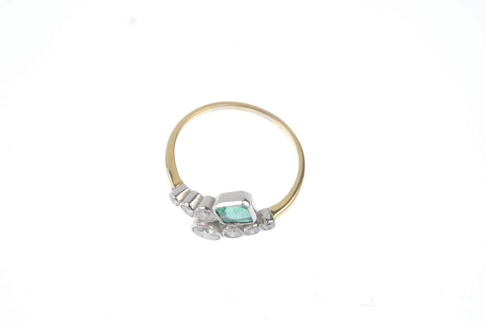 An emerald and diamond dress ring. Designed as two graduated brilliant-cut diamond crossover - Image 2 of 3