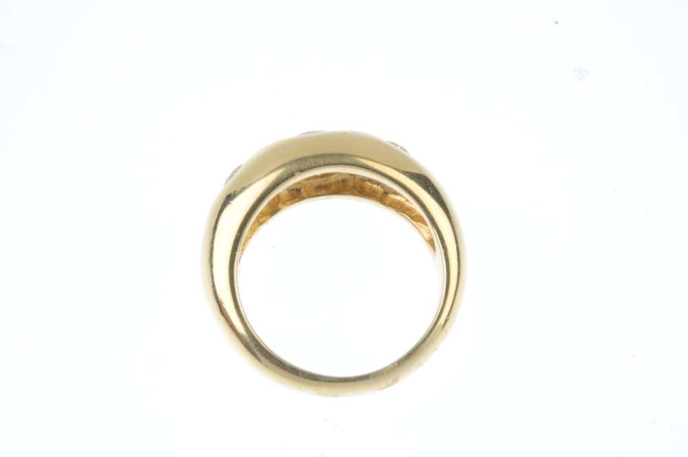 A gentleman's 18ct gold diamond three-stone ring. The brilliant-cut diamond graduated line, inset to - Image 3 of 4