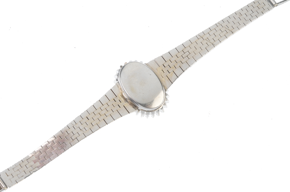 A lady's 1970s diamond cocktail watch. The oval-shape dial, with baton markers, within a single- - Image 2 of 3