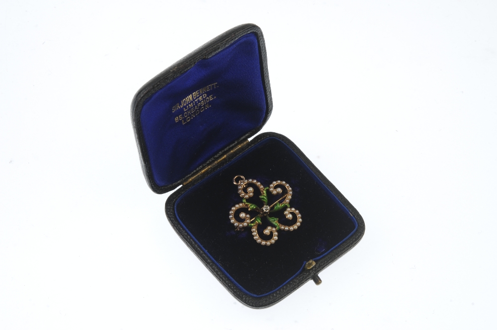 An enamel and split pearl pendant. The old-cut diamond, within a green enamel foliate surround, to - Image 3 of 3