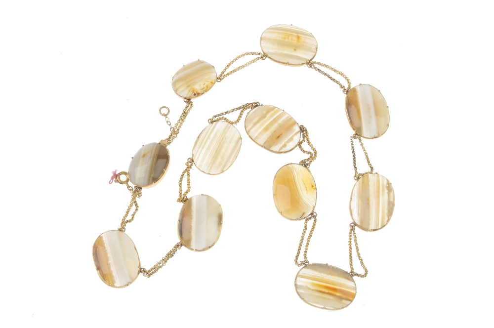 An early 19th century gold agate necklace. Designed as a series of banded agate panels, with fancy- - Image 2 of 2