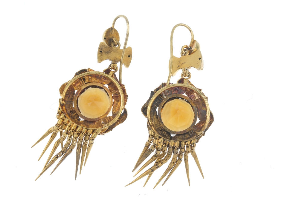 A pair of citrine ear pendants. Each designed as a circular-shape citrine, with entwined foliate - Image 2 of 2