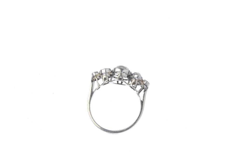 A diamond five-stone ring. The graduated old-cut diamond collet line, to the plain band. Estimated - Image 3 of 3