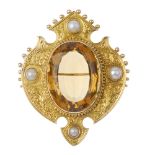 A late 19th century citrine and split pearl Cairngorm brooch. The oval-shape citrine, to the rope-