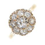 A mid 20th century 18ct gold diamond cluster ring. The old-cut diamond cluster, to the tapered