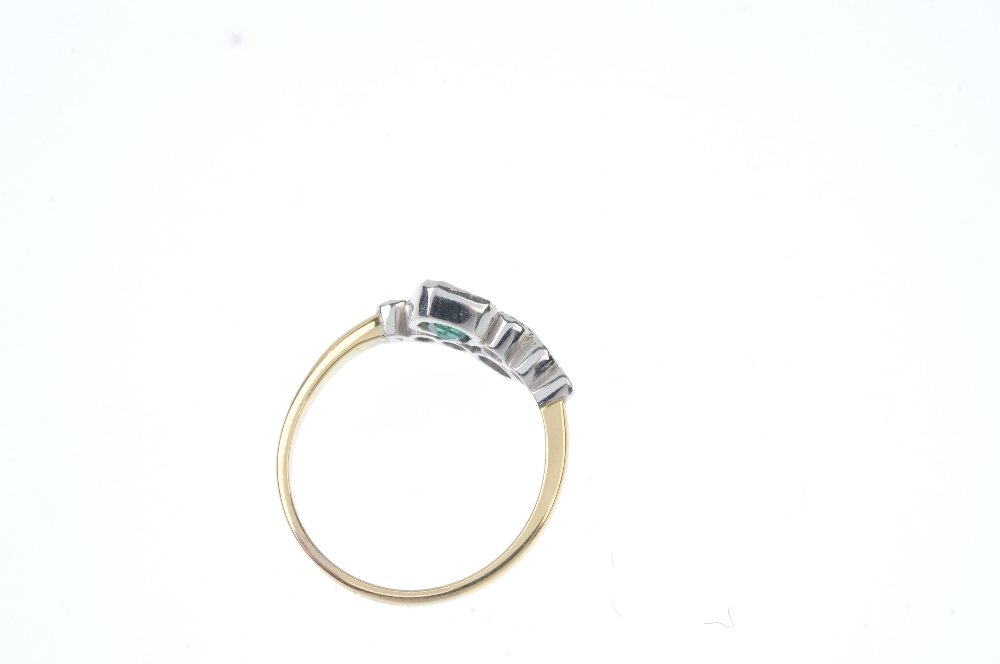 An emerald and diamond dress ring. Designed as two graduated brilliant-cut diamond crossover - Image 3 of 3