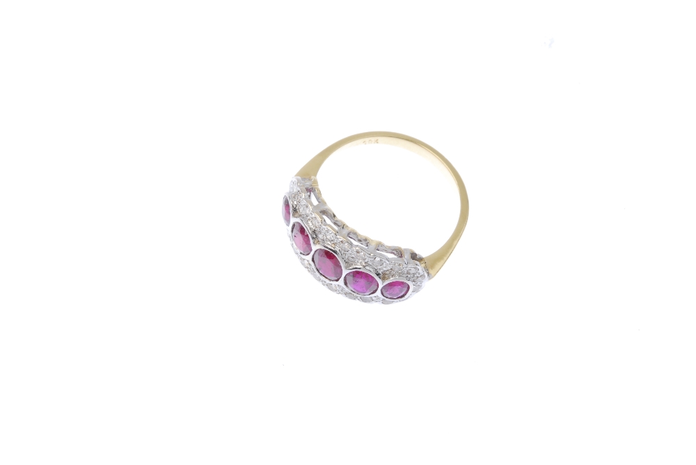 A ruby and diamond dress ring. The oval-shape ruby collet graduated line, within a brilliant-cut - Image 2 of 3