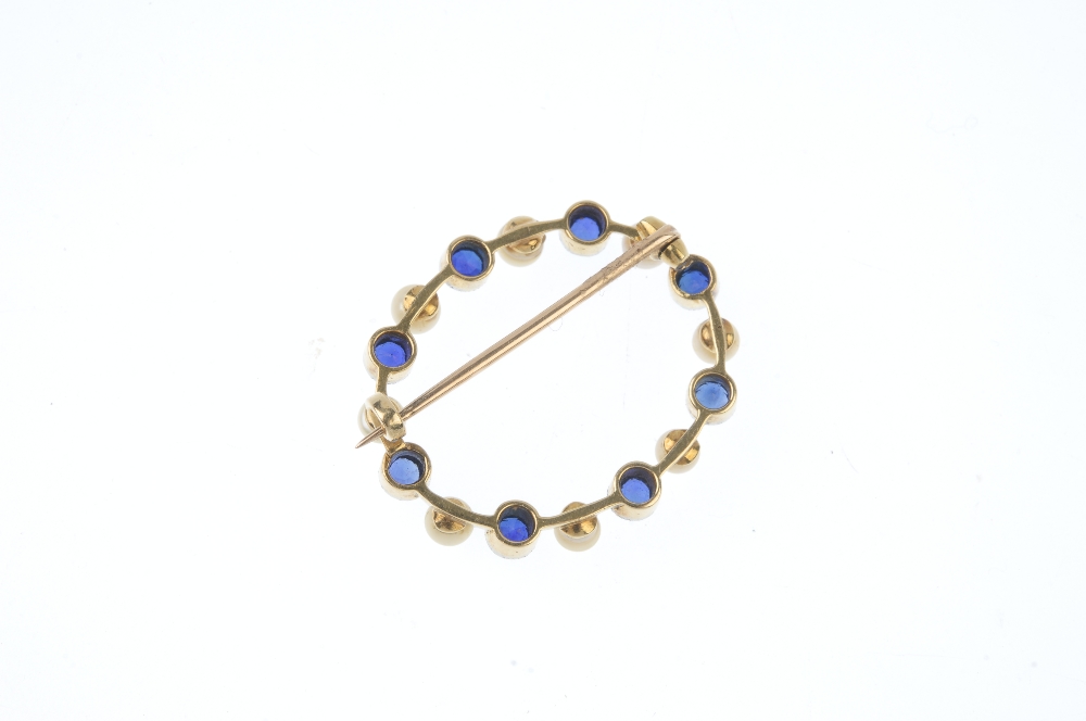 An early 20th century gold sapphire and seed pearl wreath brooch. Comprising an alternating - Image 2 of 2