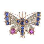 A diamond and gem-set brooch. Designed as a butterfly, set throughout with vari-cut rubies,