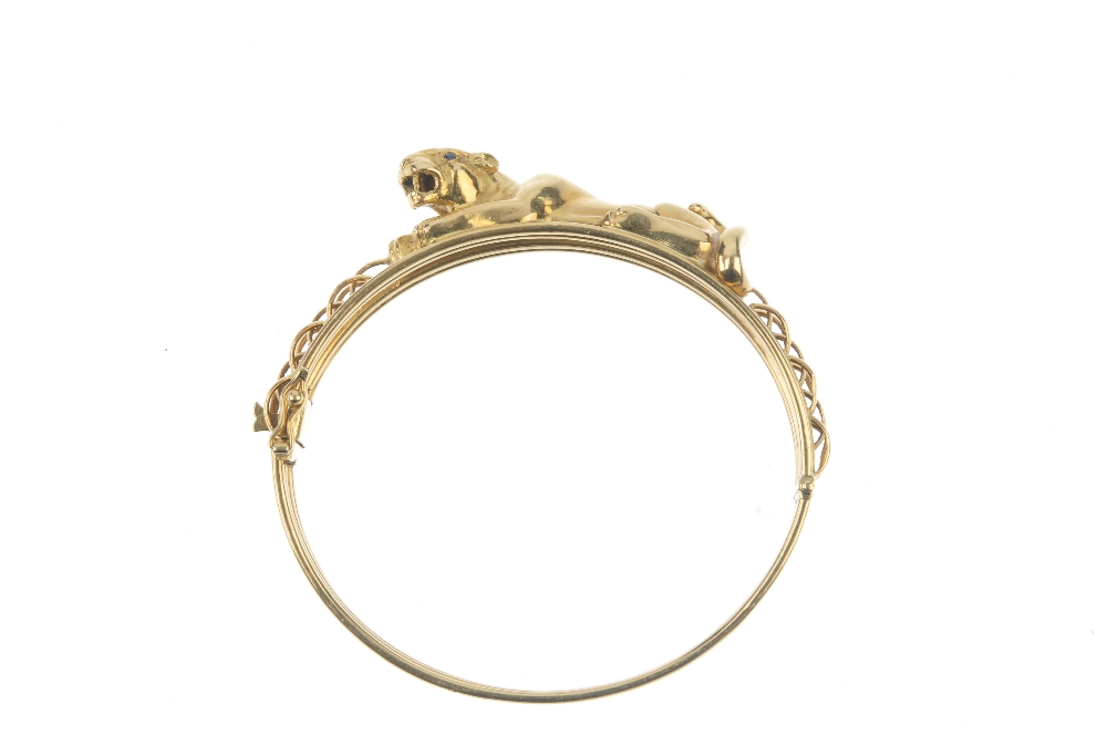 A panther bangle. Designed as a lying panther, with sapphire eyes, to the brick motif sides and - Image 2 of 4