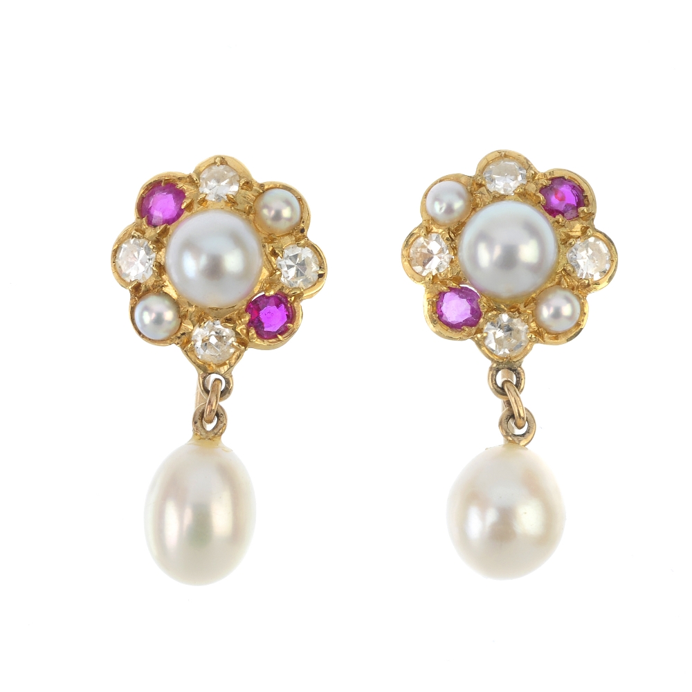 A pair of cultured pearl, diamond and ruby ear pendants. Each designed as a cultured pearl drop,