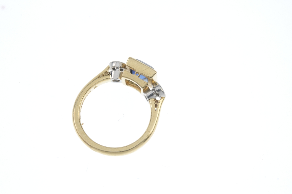 BOODLE & DUNTHORNE - an 18ct gold sapphire and diamond three-stone ring. The square-shape - Image 3 of 3