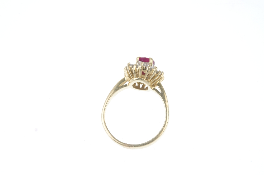 A ruby and diamond cluster ring.  The cushion-shape ruby, within a tapered baguette-cut diamond - Image 3 of 3
