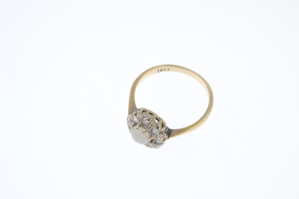 A mid 20th century 18ct gold opal and diamond cluster ring. The circular opal cabochon, within a - Image 2 of 3