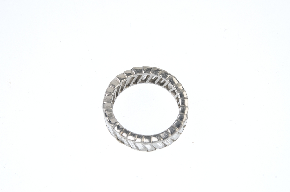 A diamond full-circle eternity ring. Designed as a baguette-cut diamond line, set at an angle. - Image 3 of 3