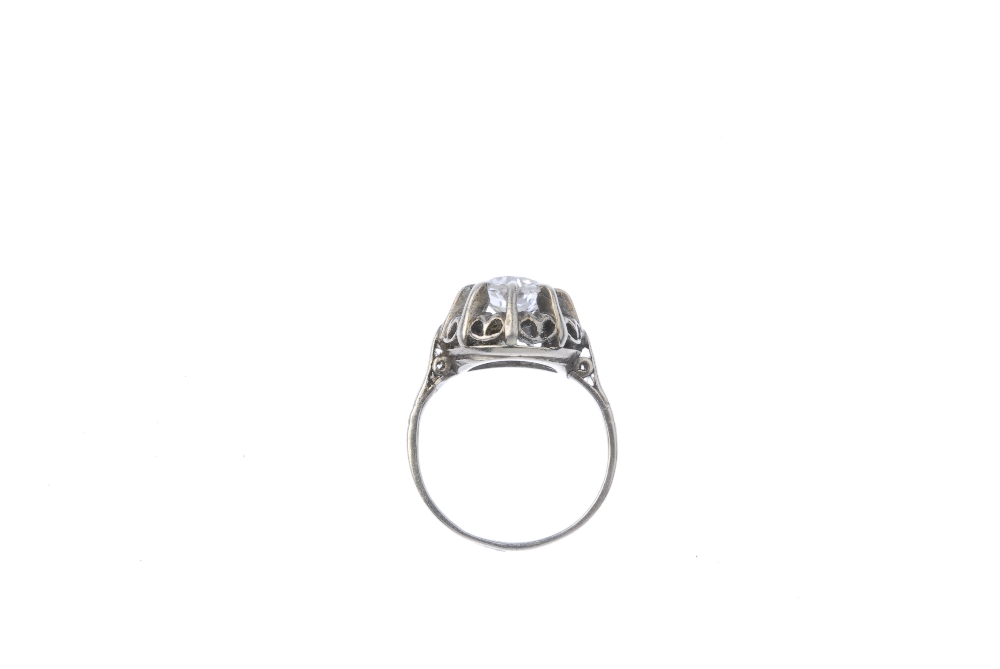 A mid 20th century diamond single-stone ring. The old-cut diamond, within an undulating surround, to - Image 3 of 3