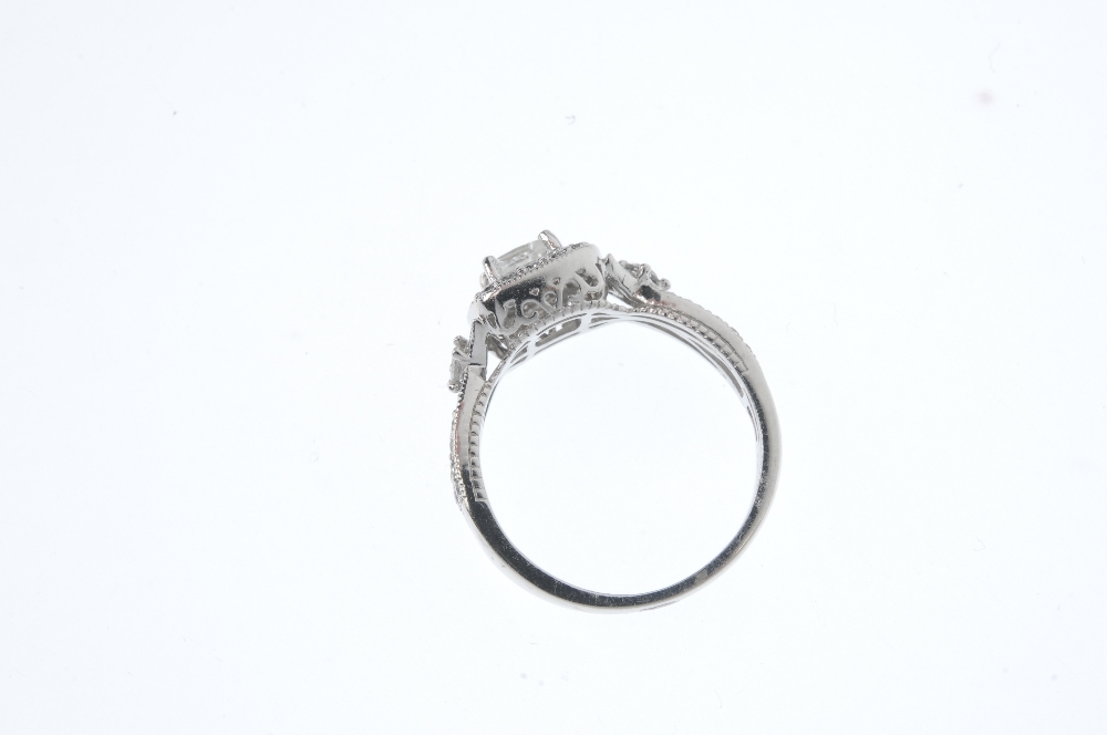 A diamond cluster ring. The square-shape diamond, within a pave-set diamond border to the pave-set - Image 3 of 3