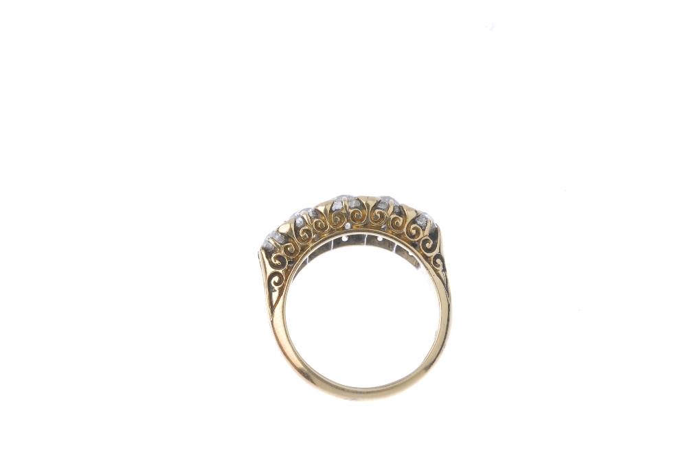 An early 20th century 18ct gold diamond five-stone ring. The old-cut diamond graduated line, with - Image 3 of 3