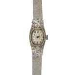 LONGINES - a lady's mid 20th century diamond cocktail watch. The oval-shape cream dial, with black