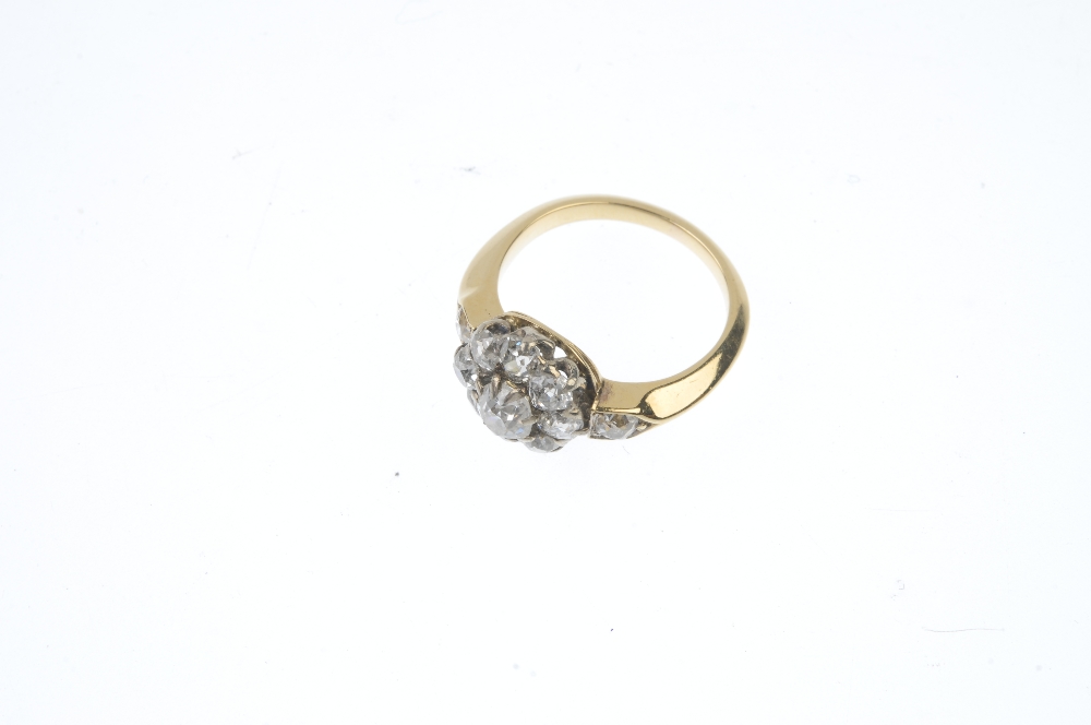 A mid 20th century gold diamond cluster ring. The old-cut diamond cluster, to the similarly-cut - Image 2 of 3