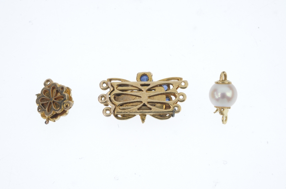 A selection of three clasps. To include a sapphire butterfly clasp, a mid 20th century split pearl - Image 2 of 2