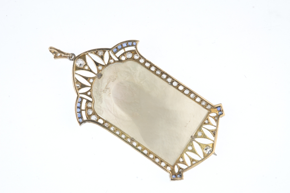 A mother-of-pearl, synthetic sapphire and diamond pendant. The mother-of-pearl panel, carved to - Image 2 of 2