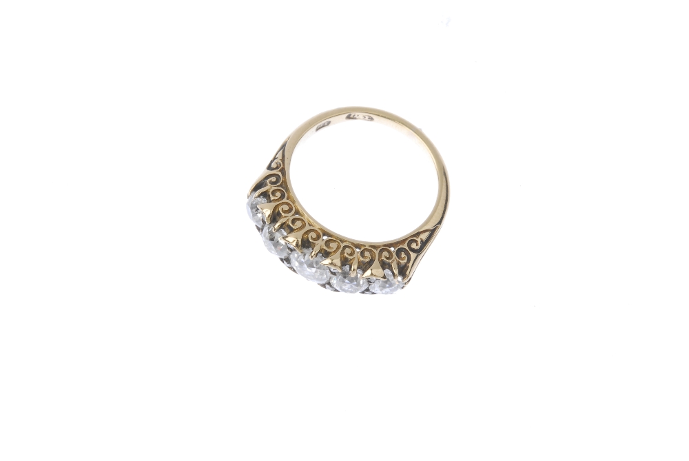 An early 20th century 18ct gold diamond five-stone ring. The old-cut diamond graduated line, with - Image 2 of 3