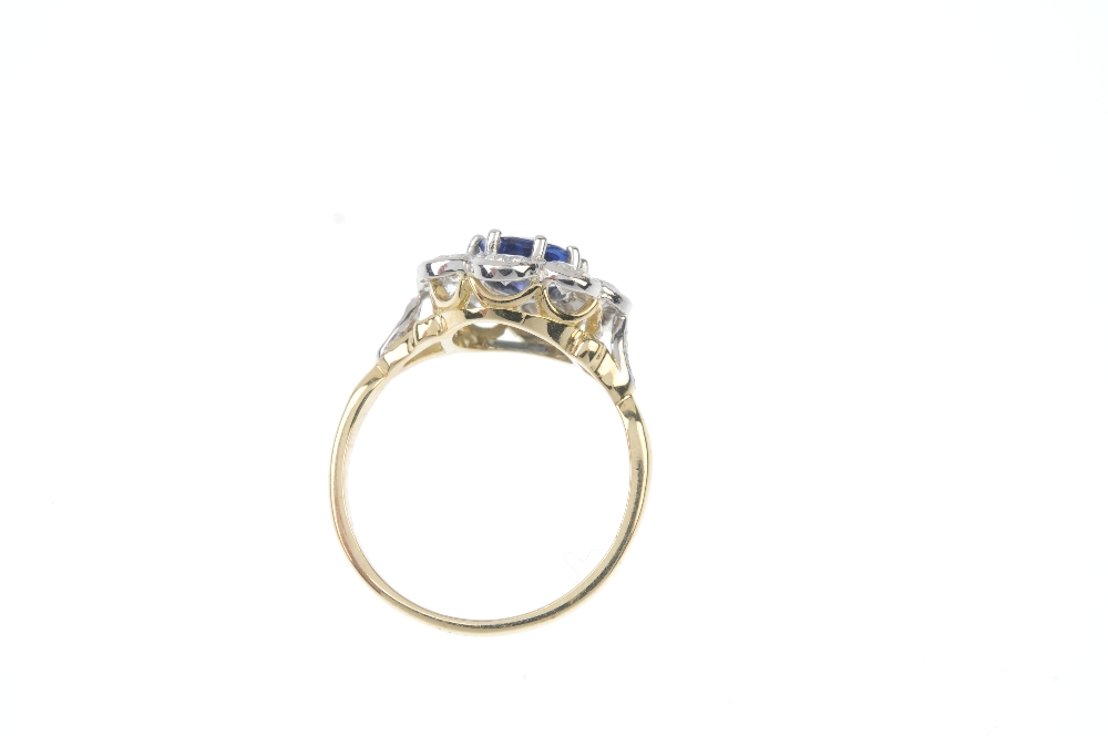 A sapphire and diamond cluster ring. The oval-shape sapphire, within a brilliant-cut diamond - Image 3 of 3