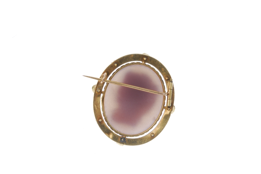 A late 19th century gold hardstone, split pearl and enamel cameo brooch. Carved to depict a - Image 2 of 2