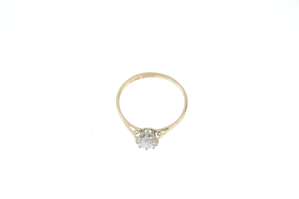A diamond single-stone ring. The brilliant-cut diamond, to the tapered sides and plain band. - Image 2 of 3
