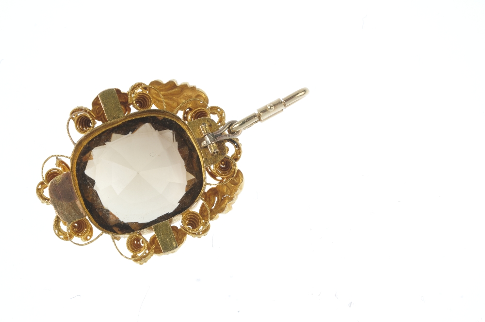 A late 19th century gold citrine pendant. The cushion-shape citrine, within a cannetille surround. - Image 2 of 2