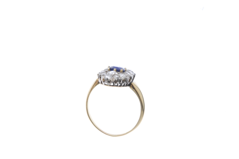 A sapphire and diamond cluster ring. The cushion-shape sapphire, within an old-cut diamond - Image 3 of 3