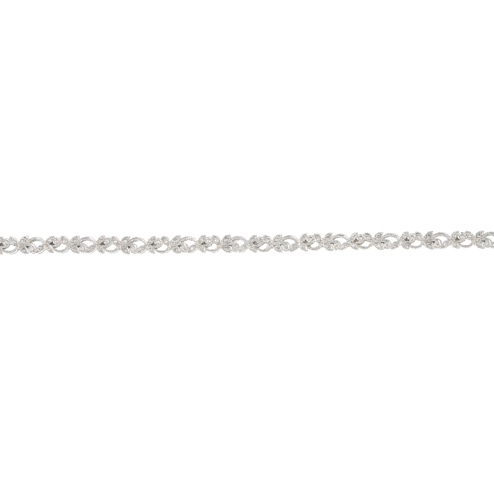 An 18ct gold diamond bracelet. Of repeating scrolling foliate design, set throughout with