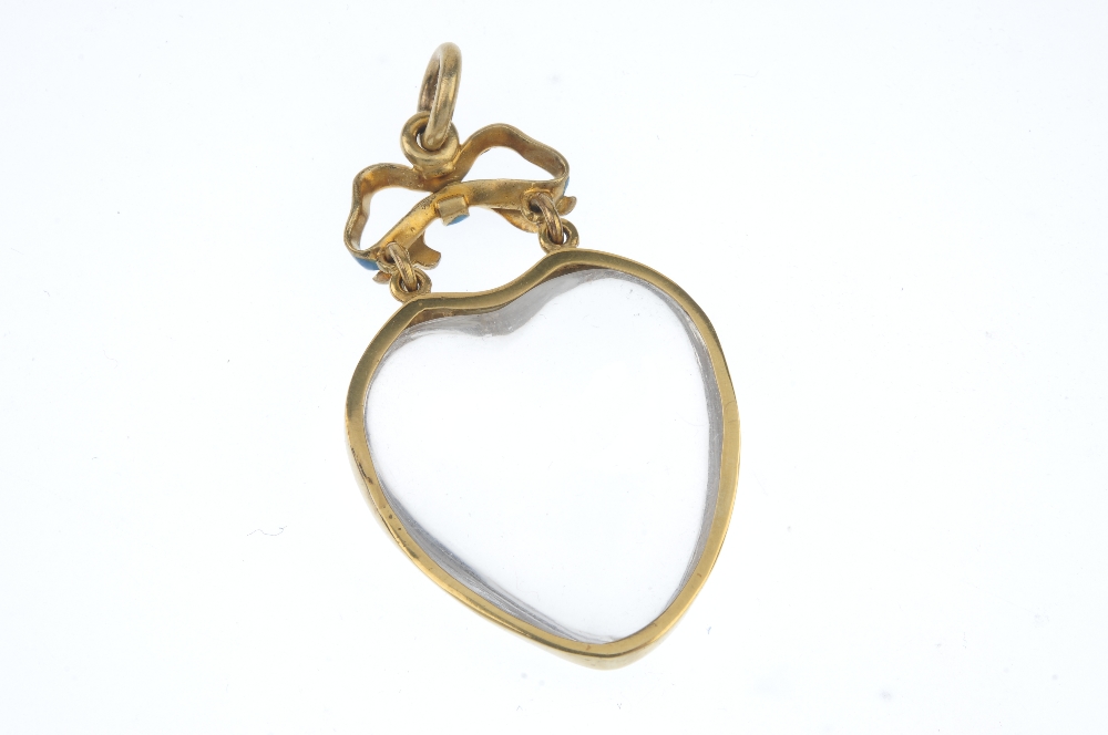 A late 19th century gold rock crystal enamel and quartz heart pendant. The heart-shape rock - Image 2 of 3