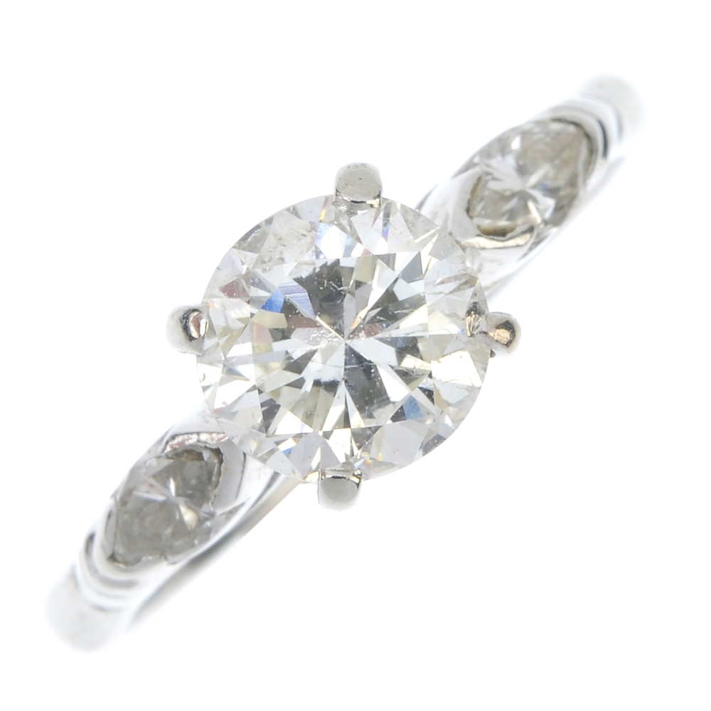 An 18ct gold diamond single-stone ring. The brilliant-cut diamond, to the marquise-shape diamond