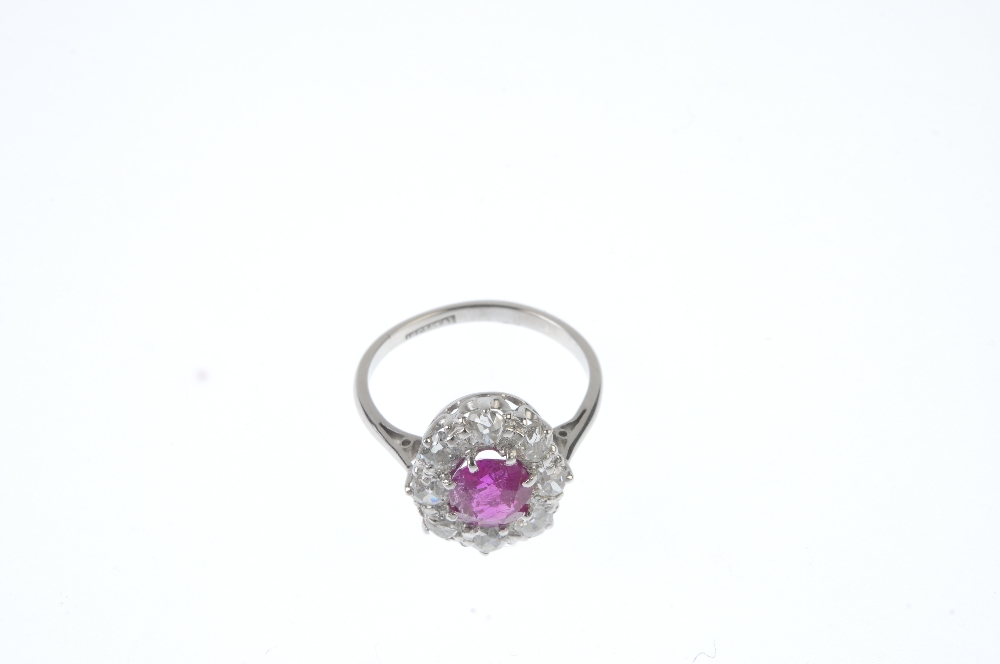 A Burmese ruby and diamond ring. The oval-shape ruby, weighing 1.35cts, within an old-cut diamond - Image 2 of 4