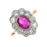 A ruby and diamond cluster ring. The oval-shape ruby collet, within an old-cut diamond surround,